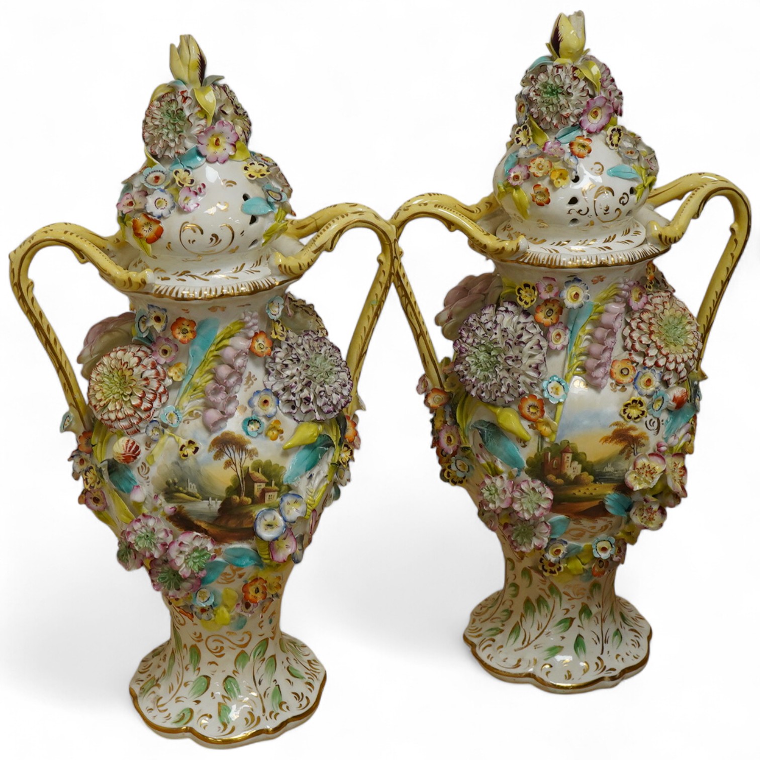 A pair of English porcelain floral encrusted vases and covers, c.1830, possibly Samuel Alcock, each painted with landscapes, 44cm high